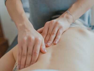 hands massaging woman's body