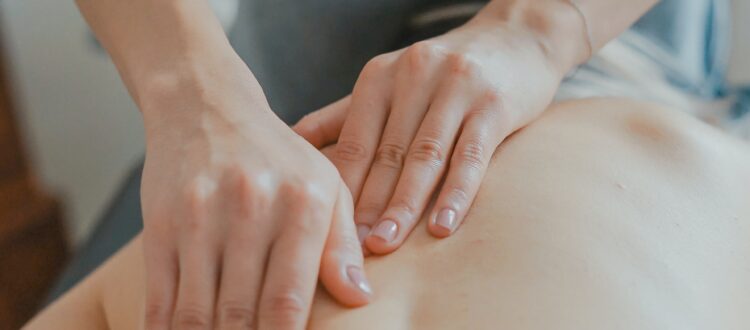 hands massaging woman's body
